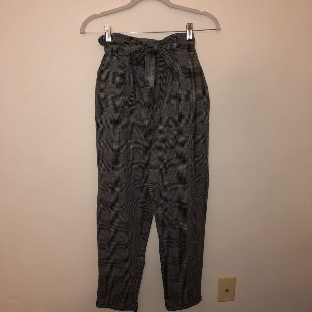 Plaid black-and-white ankle pants with a belt